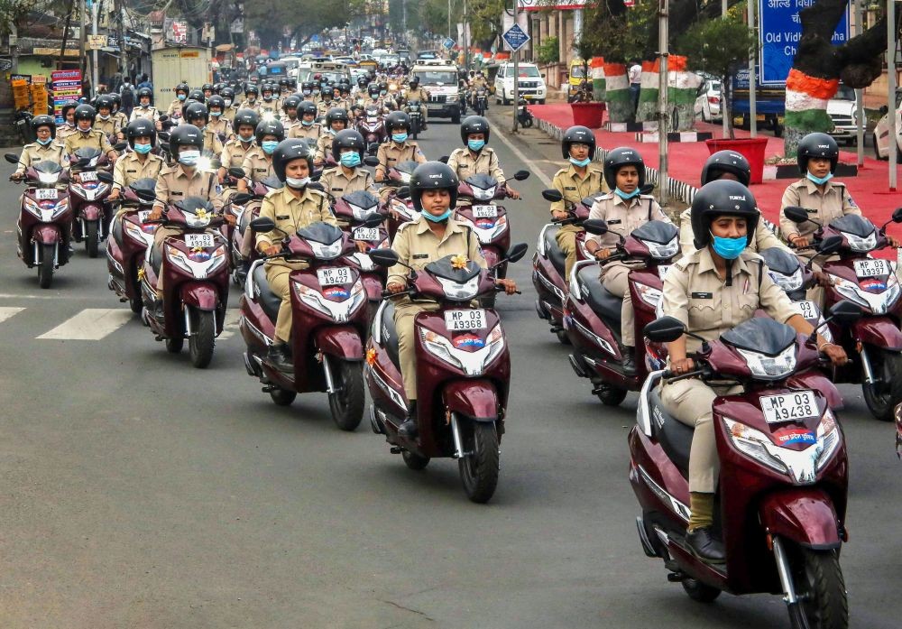 Bhopal: Female police personnel ride their two-wheelers during a rally for the launch of the 'Urja Mahila' help desk for women's safety, on International Women's Day, in Bhopal, Tuesday, March 8, 2022. The rally was flagged off by Madhya Pradesh Chief Minister Shivraj Singh Chouhan. (PTI Photo)