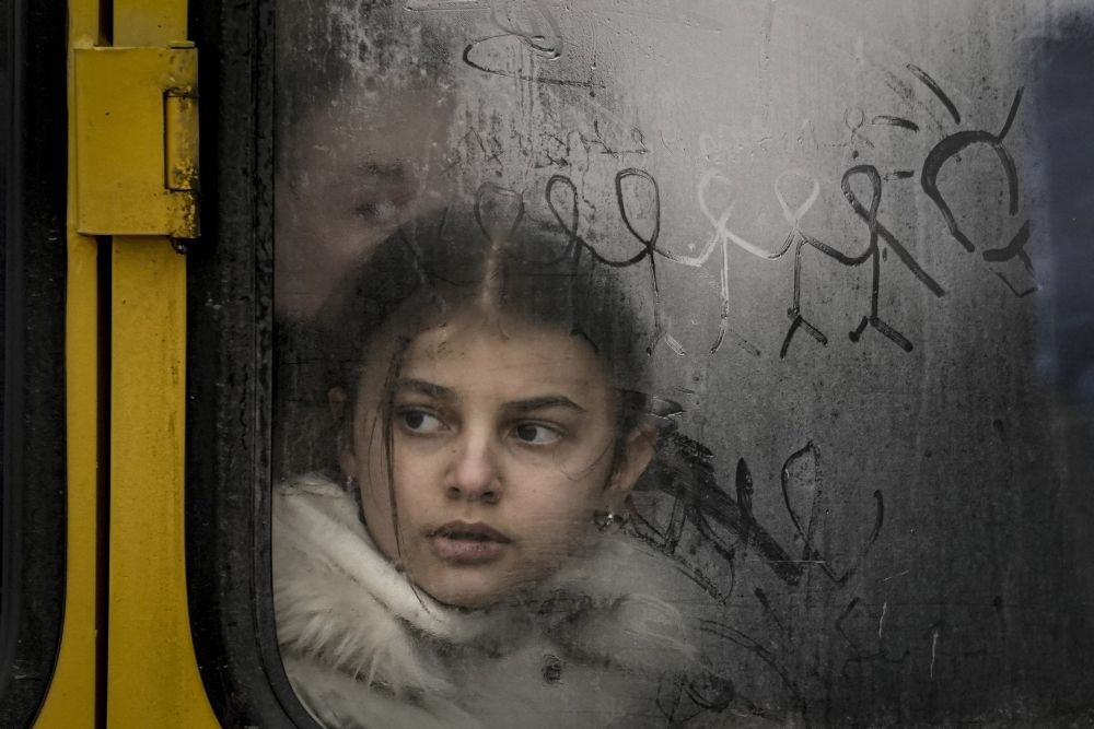 Irpin: A child looks out a steamy bus window with drawings on it as civilians are evacuated from Irpin, on the outskirts of Kyiv, Ukraine, Wednesday, March 9, 2022. A Russian airstrike devastated a maternity hospital Wednesday in the besieged port city of Mariupol amid growing warnings from the West that Moscow's invasion is about to take a more brutal and indiscriminate turn. AP/PTI(