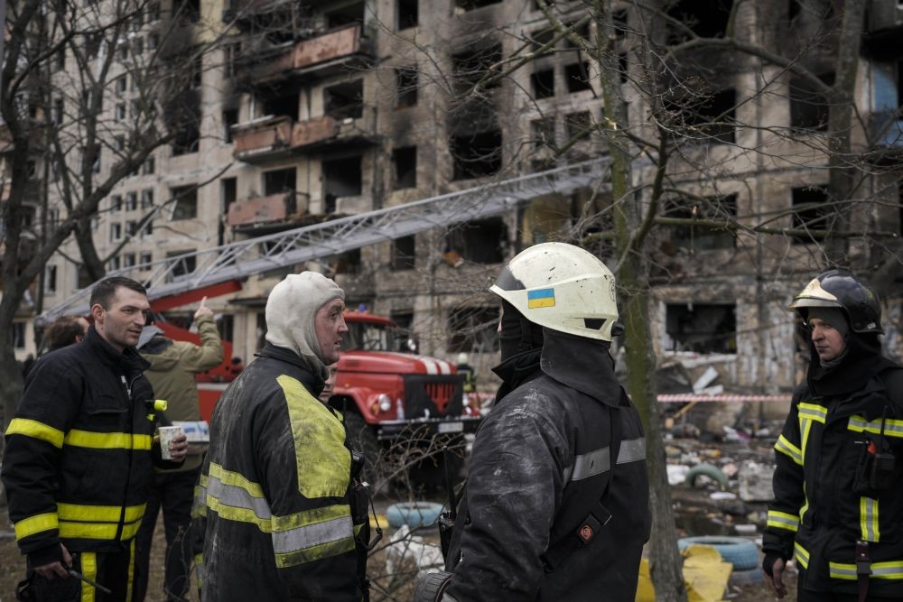 Kyiv: Ukrainian firefighters work in a resident building after it was hit by artillery shelling in Kyiv, Ukraine, Monday, March 14, 2022. AP/PTI(AP03_14_2022_000107B)