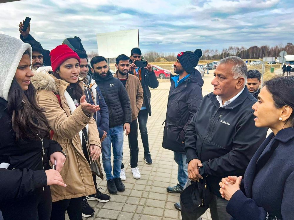 Budomierz: Union Minister of State for Civil Aviation General (retd.) Vijay Kumar Singh interacts with Indian students, during his visit to Poland to facilitate the evacuation of Indians stranded in war-torn Ukraine, at the Poland-Ukraine border, in Budomierz. (PTI Photo)