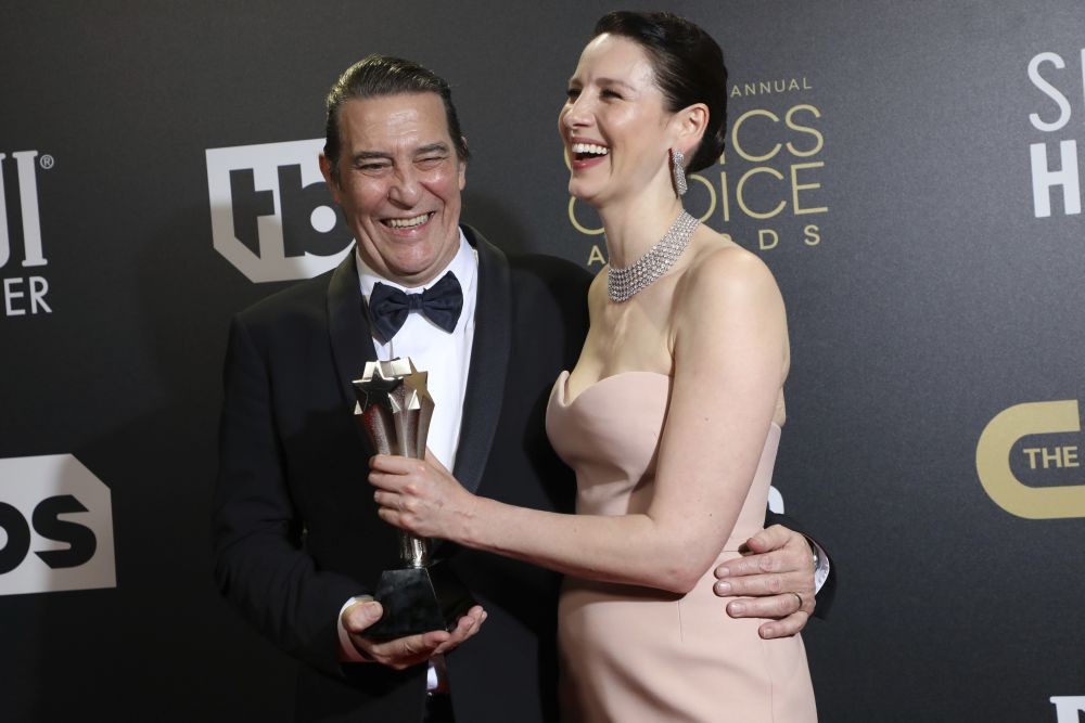London : Ciaran Hinds, left, and Caitriona Balfe, winners of the award for best ensemble for "Belfast," attend the Critics Choice Awards celebration at The Savoy Hotel on Sunday, March 13, 2022, in London. AP/PTI