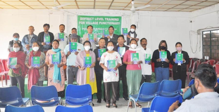 Issuing of manual books to the attendees during the two-day training programme at Mon town. (Photo Courtesy: DRDA Mon)