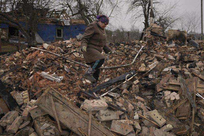 Mariya, a local resident, looks for personal items in the rubble of her house, destroyed during fighting between Russian and Ukrainian forces in the village of Yasnohorodka, on the outskirts of Kyiv, Ukraine, Wednesday, March 30, 2022. (AP Photo)