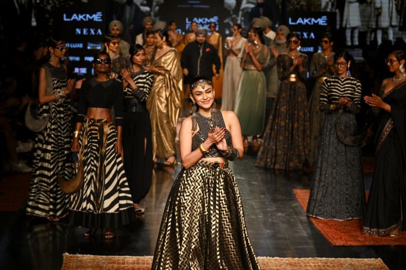 Models showcase creations of designer J.J. Valaya during the first day of Lakme Fashion Week, in New Delhi on March 23, 2022. (PTI Photo)
