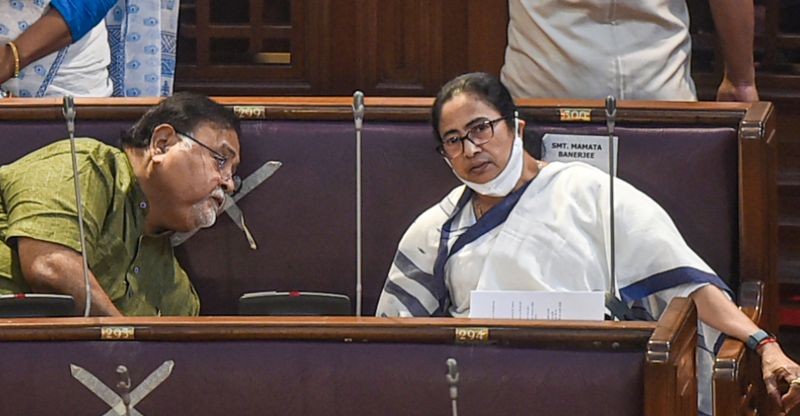 West Bengal Chief Minister Mamata Banerjee talks with TMC General Secretary Partha Chatterjee during the budget session of West Bengal Legislative Assembly, in Kolkata on March 11, 2022. (PTI Photo)