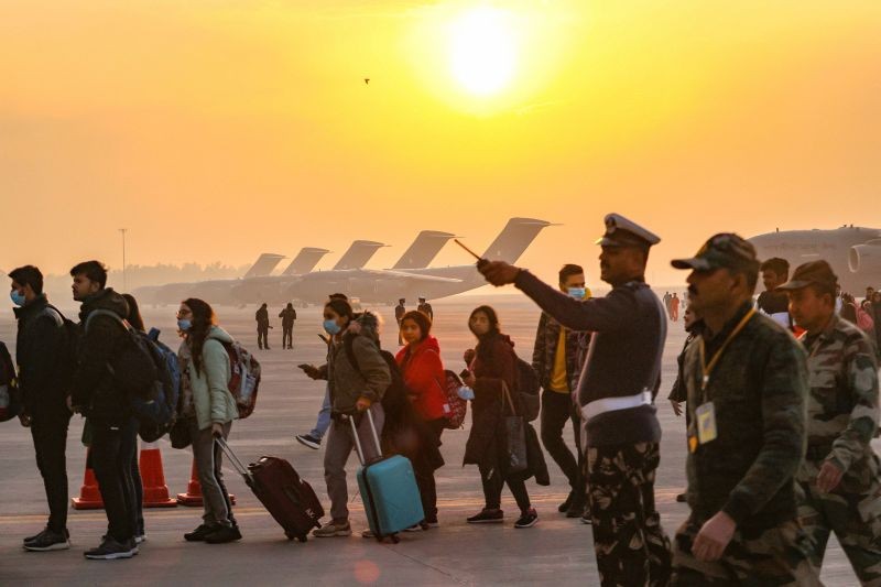 Indian nationals, evacuated from crisis-hit Ukraine, upon their arrival at the Hindon Air Force Station in Ghaziabad, early on March 3, 2022. As part of Operation Ganga, the first IAF C-17 Globemaster aircraft carrying 200 passengers, mostly students returned to Hindan airbase near Delhi, from Bucharest at around 1:00 AM. (PTI Photo)
