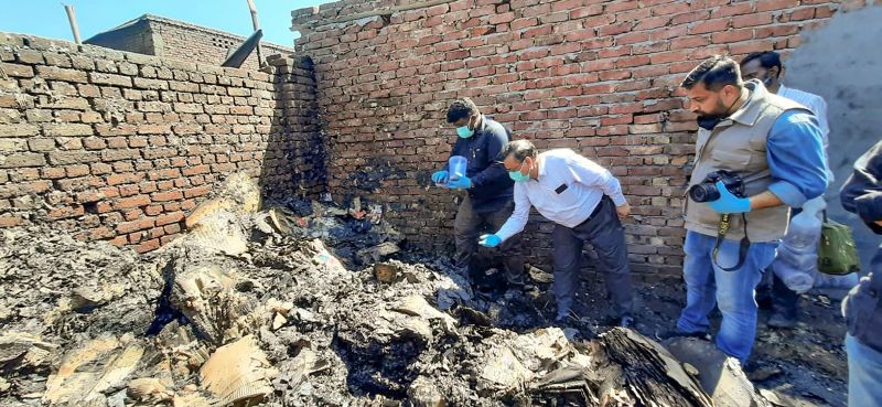 Forensic Science Laboratory team members collect samples from the spot where a fire had broken out in shanties at Gokulpuri area, in New Delhi on March 12, 2022. Seven people were killed and at least 60 shanties were affected in the incident, according to officials. (PTI Photo)
