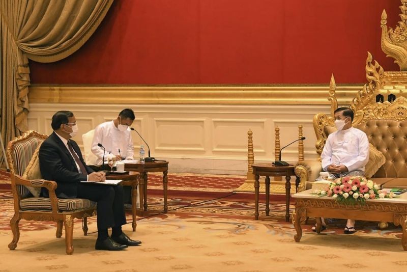 In this photo provided by the Military True News Information Team, Myanmar State Administration Council Chairman Senior General Min Aung Hlaing, right, talks with Cambodian Foreign Minister and ASEAN Special Envoy to Myanmar Prak Sokhonn during a meeting in Naypyitaw, Myanmar, Monday, March 21, 2022. Sokhonn arrived Monday in Myanmar's capital Naypyitaw on his mission as a special regional envoy seeking to facilitate peacemaking in the strife-torn, military-led nation. (AP Photo)