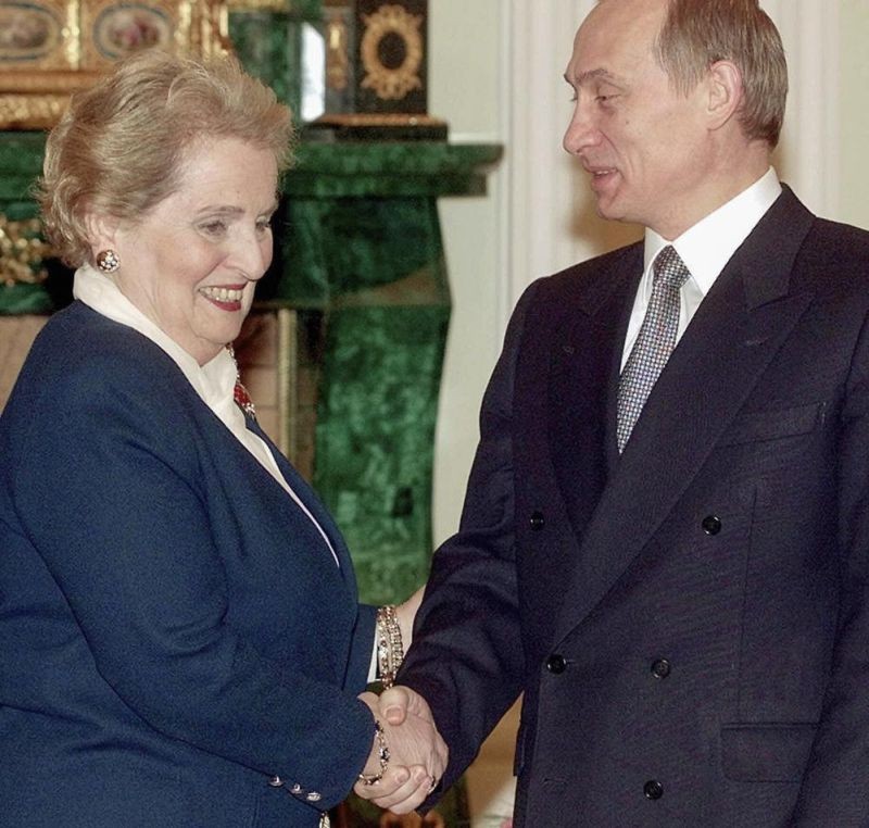 U.S. Secretary of State Madeleine Albright smiles as she shakes hands with Russian acting President Vladimir Putin, right, in Moscow's Kremlin, on Feb. 2, 2000. Albright has died of cancer, her family said Wednesday, March 23, 2022. (AP File Photo)