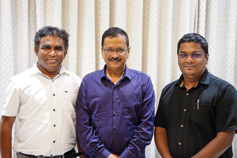 New Delhi: Delhi CM and AAP convenor Arvind Kejriwal with newly elected party MLAs from Goa Venzy Viegas (R) and Cruz Silva (L), in New Delhi, Friday, March 11, 2022. (PTI Photo)