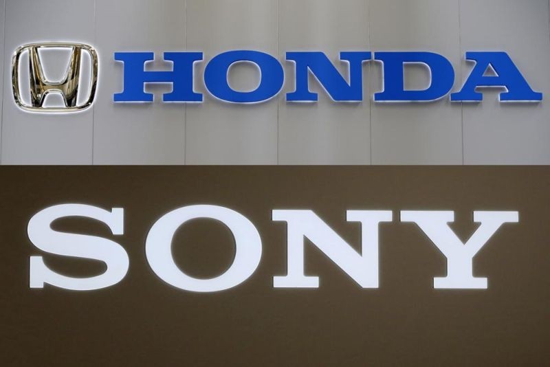 In this combination image, logos are seen for Honda Motor Co., and Sony Corp. Sony Corp. and Honda Motor Co. agreed to set up a joint venture this year to start selling an electric vehicle by 2025, both sides said on March 4, 2022. (AP File Photo)