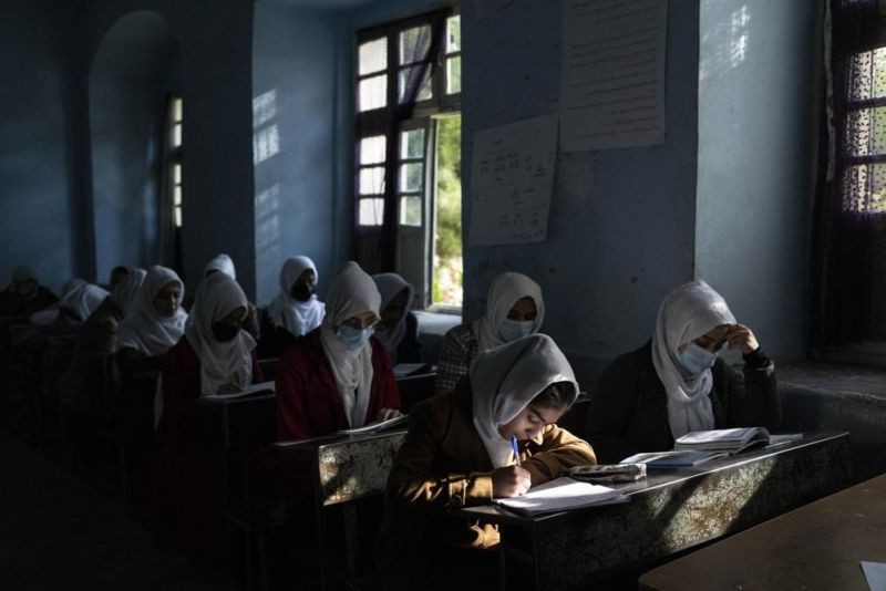 Afghan girls participate in a lesson at Tajrobawai Girls High School in Herat, Afghanistan on Nov. 25, 2021. In a surprise decision the hardline leadership of Afghanistan's new rulers has decided against opening educational institutions to girls beyond Grade six, a Taliban official said Wednesday, March 23, 2022 on the first day of Afghanistan's new school year. (AP File Photo)