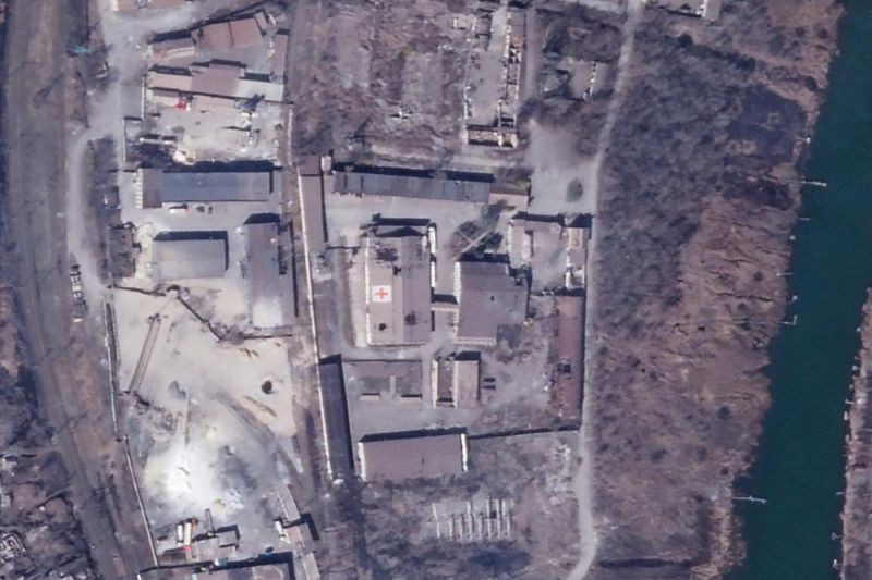 In this satellite photo from Planet Labs PBC, an International Committee of the Red Cross warehouse is seen with apparent damage from shelling in Mariupol, Ukraine, Monday, March 28, 2022. The Red Cross warehouse in the besieged Ukrainian port city of Mariupol has been struck amid intense Russian shelling of the area. The Red Cross said it distributed all the supplies from inside the warehouse earlier in March and no staff have been at the site since March 15. (AP Photo)