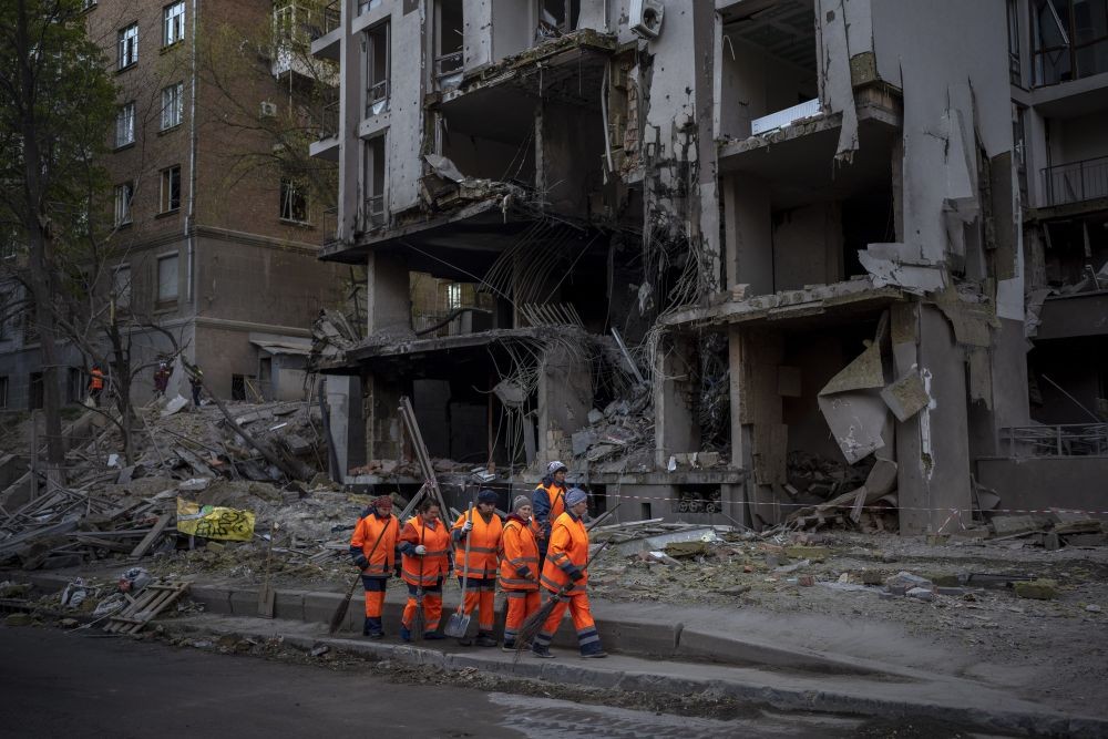 Kyiv:  Clean-up crews prepare to work at the site of an explosion in Kyiv, Ukraine on Friday, April 29, 2022. Russia struck the Ukrainian capital of Kyiv shortly after a meeting between President Volodymyr Zelenskyy and U.N. Secretary-General AntÃ³nio Guterres on Thursday evening. AP/PTI(AP04_29_2022_000056B)