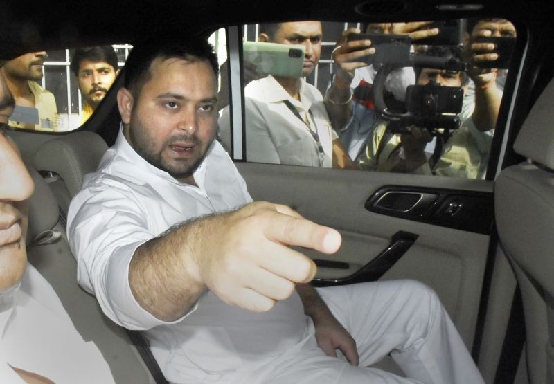 RJD leader Tejashwi Yadav leaves the party office after a meeting with party senior leaders, in Patna on April 25. (PTI Photo)