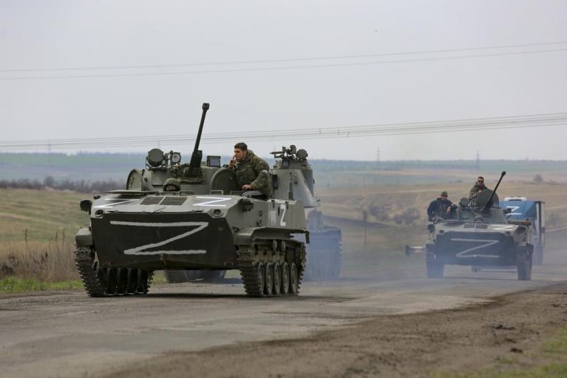 Russian military vehicles move on a highway in an area controlled by Russian-backed separatist forces near Mariupol, Ukraine, April 18, 2022. Mariupol, a strategic port on the Sea of Azov, has been besieged by Russian troops and separatist forces in eastern Ukraine for more than six weeks. (AP Photo)
