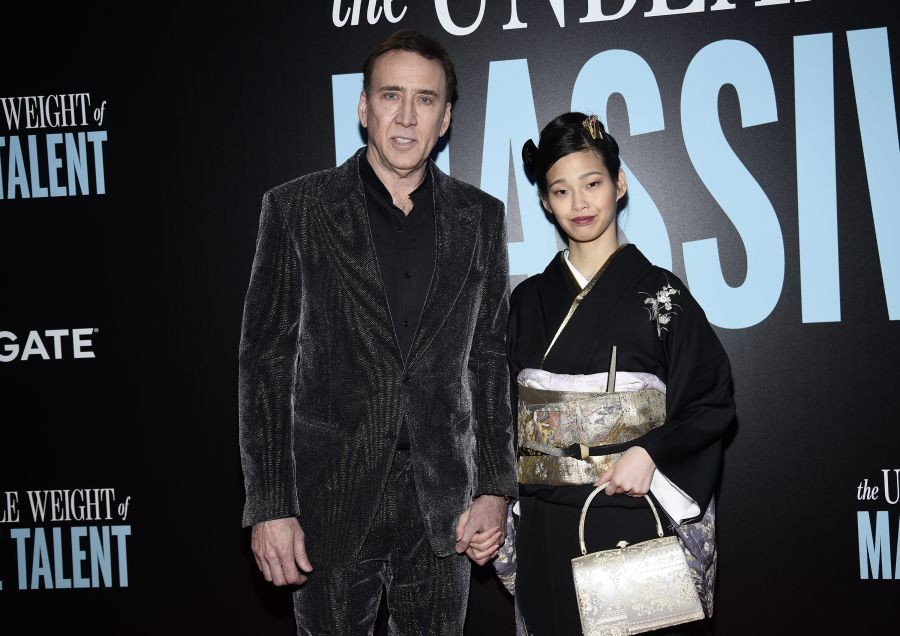 New York: Actor Nicolas Cage, left, and wife Riko Shibata attend the special screening of "The Unbearable Weight of Massive Talent" at Regal Essex Crossing on Sunday, April 10, 2022, in New York. AP/PTI