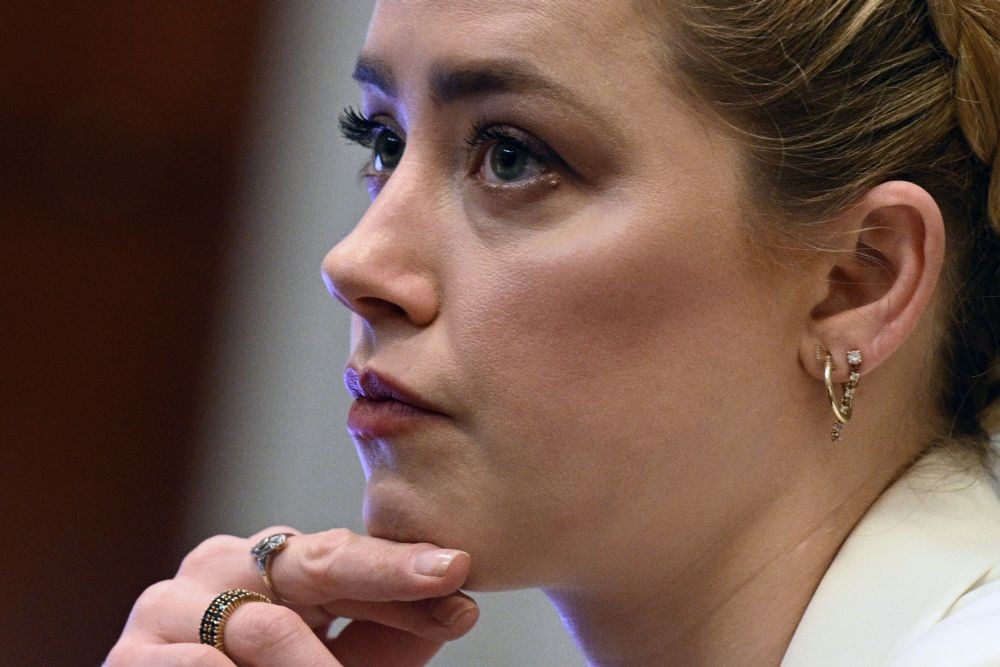 Fairfax : Actress Amber Heard listens in the courtroom at the Fairfax County Circuit Court in Fairfax, Va., Tuesday, April 26, 2022. Actor Johnny Depp sued his ex-wife Amber Heard for libel in Fairfax County Circuit Court after she wrote an op-ed piece in The Washington Post in 2018 referring to herself as a "public figure representing domestic abuse." AP/PTI(