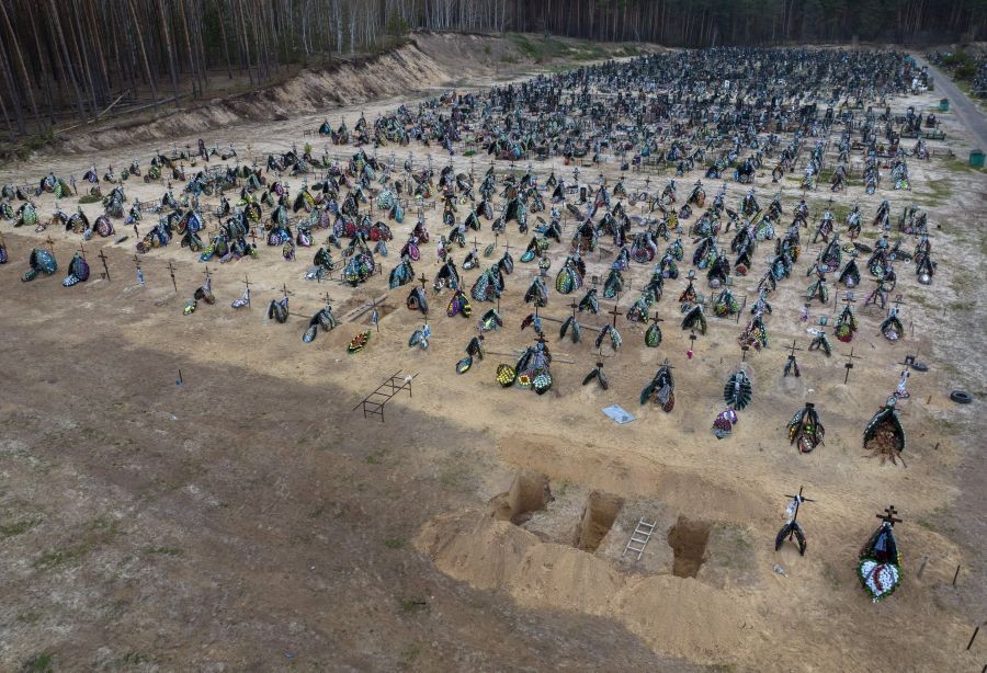 Kyiv: Three dug graves are ready for the next funerals at the cemetery in Irpin, on the outskirts of Kyiv, Ukraine, Tuesday, April 19, 2022. AP/PTI