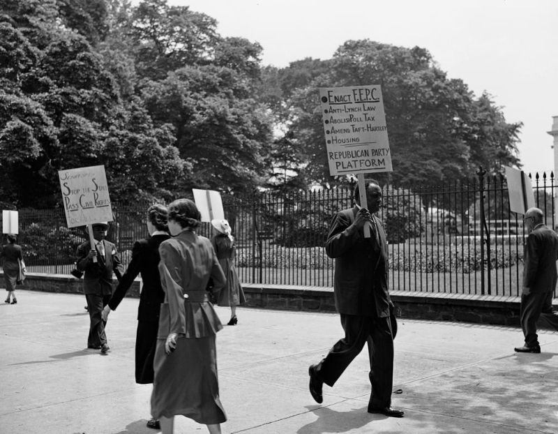Singer Paul Robeson marches in front of the White House in Washington, May 24, 1950, where protesters carry signs demanding passage of fair employment practices legislation. Genealogists and historians can get a microscopic look at sweeping historical trends when individual records from the 1950 census are released this week. Researchers view the records that will be released Friday, March 31, 2022 as a gold mine, and amateur genealogists see it as a way to fill gaps in family trees. (AP File Photo)