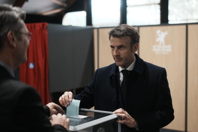 French President and centrist presidential candidate for reelection Emmanuel Macron casts his ballot for the first round of the presidential election on April 10, in Le Touquet, northern France. Polls opened across France for the first round of the country's presidential election, where up to 48 million eligible voters will be choosing between 12 candidates. President Emmanuel Macron is seeking a second five-year term, with a strong challenge from the far right. (AP Photo)