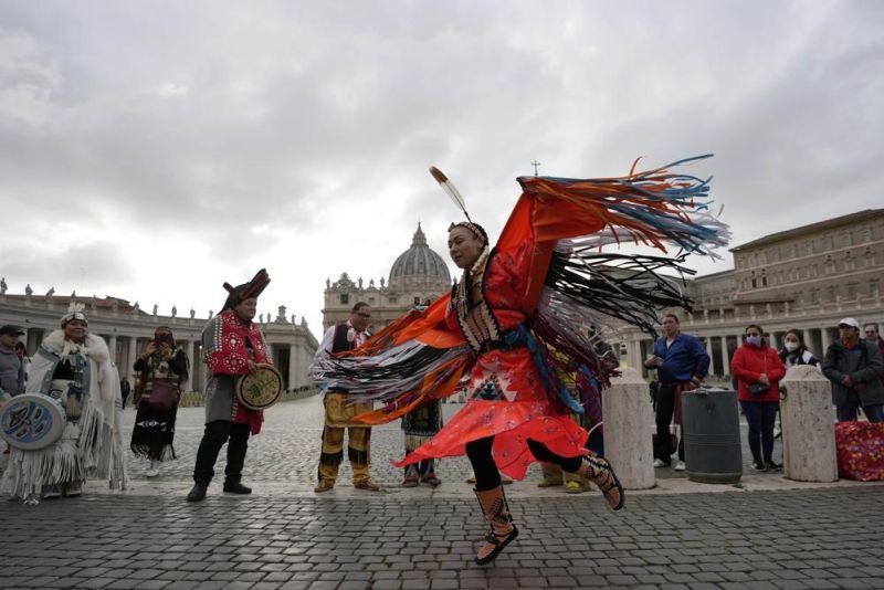Members of the Assembly of First Nations perform in St. Peter's Square at the Vatican, Thursday, March 31, 2022. Pope Francis has welcomed First Nations delegations to the Vatican. They are seeking an apology for the Catholic Church's role in running Canada's notorious residential schools for Indigenous children. (AP Photo)
