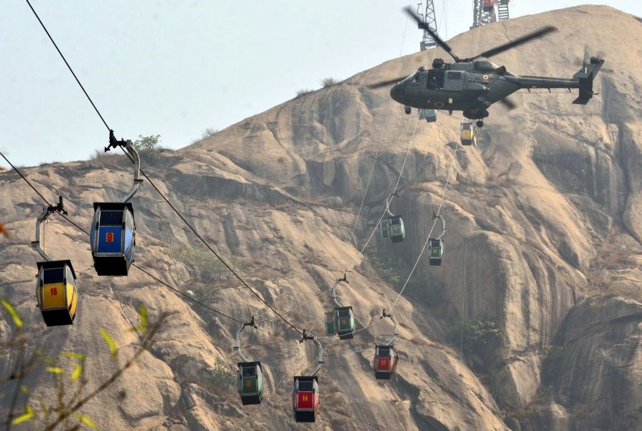 Deoghar: An IAF helicopter being used for rescue and relief operations after collision of two cable cars at Trikut Ropeway, in Deoghar district of Jharkhand, Tuesday, April 12, 2022. (PTI Photo)