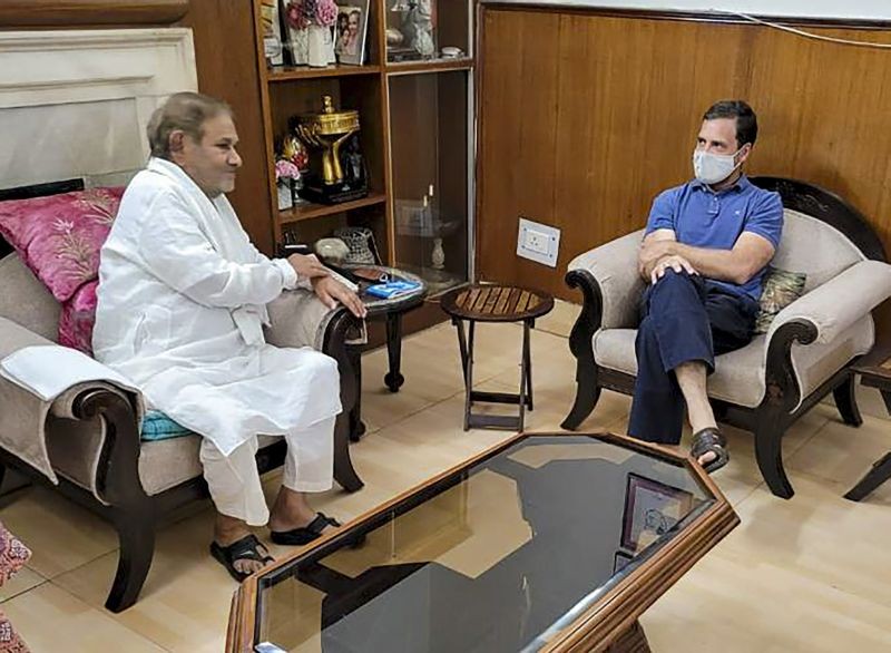 Congress leader Rahul Gandhi interacts with Rashtriya Janata Dal (RJD) leader Sharad Yadav during their meeting, at the latter's residence in New Delhi on April 8, 2022. (PTI Photo)