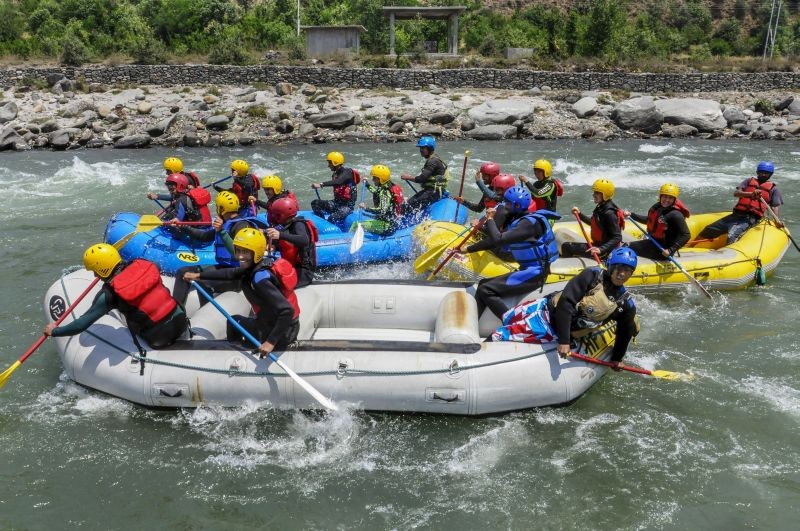Tourists participate in river rafting on the Beas river, in Kullu on April 27, 2022. (PTI Photo)