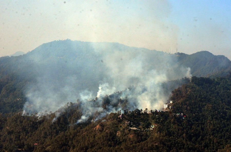 Shimla: Smoke billows from a forest fire in Shimla, Sunday, April 24, 2022. (PTI Photo)
