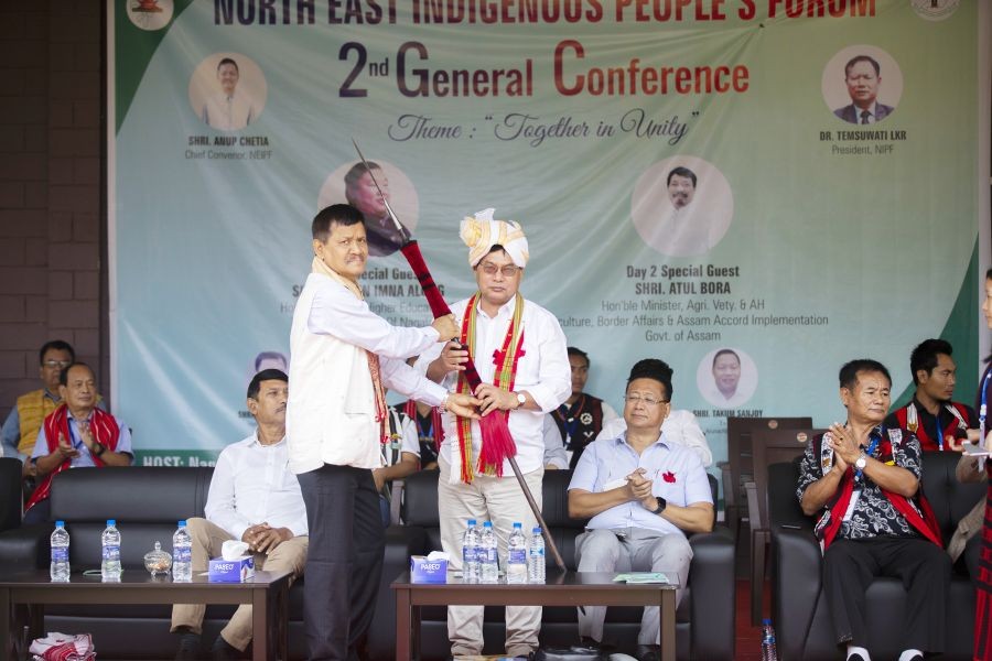 NEIPF Chairperson Anup Chetia and Tripura Minister for Tribal Welfare Mevar Kumar Jamatia during the second day of the NEIPF general conference on April 30.