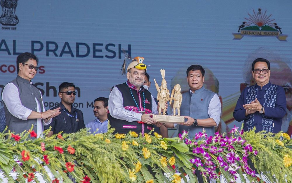 **EDS: TWITTER IMAGE POSTED BY @PemaKhandu ON SUNDAY, MAY 22, 2022** Namsai: Union Home Minister Amit Shah during a rally in Arunachal Pradesh's Namsai. Arunachal Pradesh CM Pema Khandu and Union Minister Kiren Rijiju are also seen. (PTI Photo)