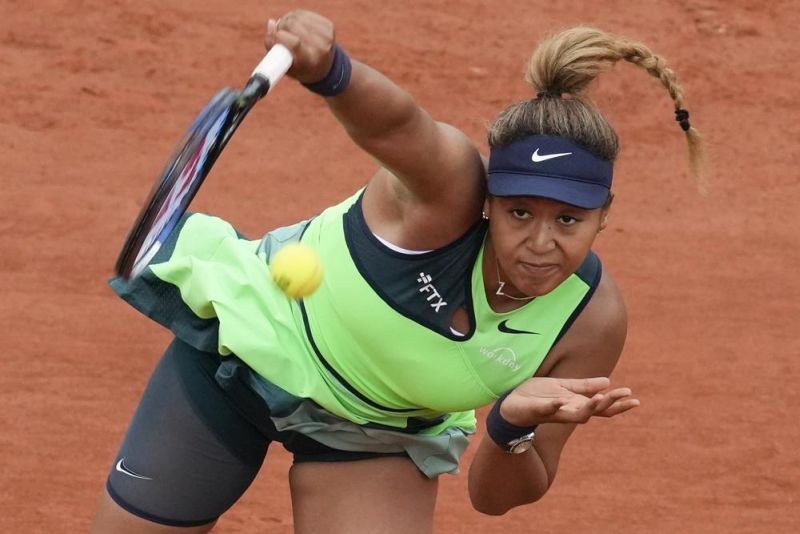 Japan's Naomi Osaka serves against Amanda Anisimova of the U.S. during their first round match at the French Open tennis tournament in Roland Garros stadium in Paris, France on May 23, 2022. Naomi Osaka's 2022 French Open is done following a first-round loss. The players remaining in the tournament see and hear products of her frank discussion about anxiety and depression a year ago -- from new "quiet rooms" and on-call psychiatrists at Roland Garros to a broader sense that mental health is a far-less-taboo topic than it once was. (AP File  Photo)