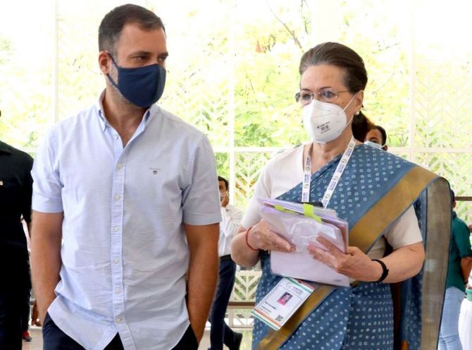 Congress interim President Sonia Gandhi with her elder child and party MP Rahul Gandhi arrives for the concluding session of the Nav Sankalp Chintan Shivir in Udaipur, May 15, 2022. Photograph: @INCIndia/Twitter
