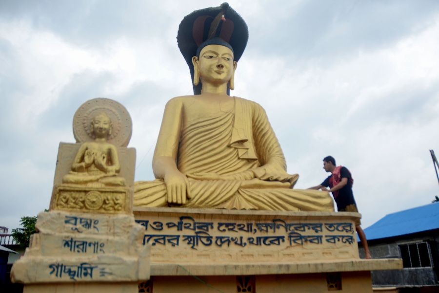 Agartala: A devotee cleans a statue of Lord Buddha at a monastery ahead of 'Wesak', which marks the birth of Lord Buddha, in Agartala, Friday, May 13, 2022. (PTI Photo)(