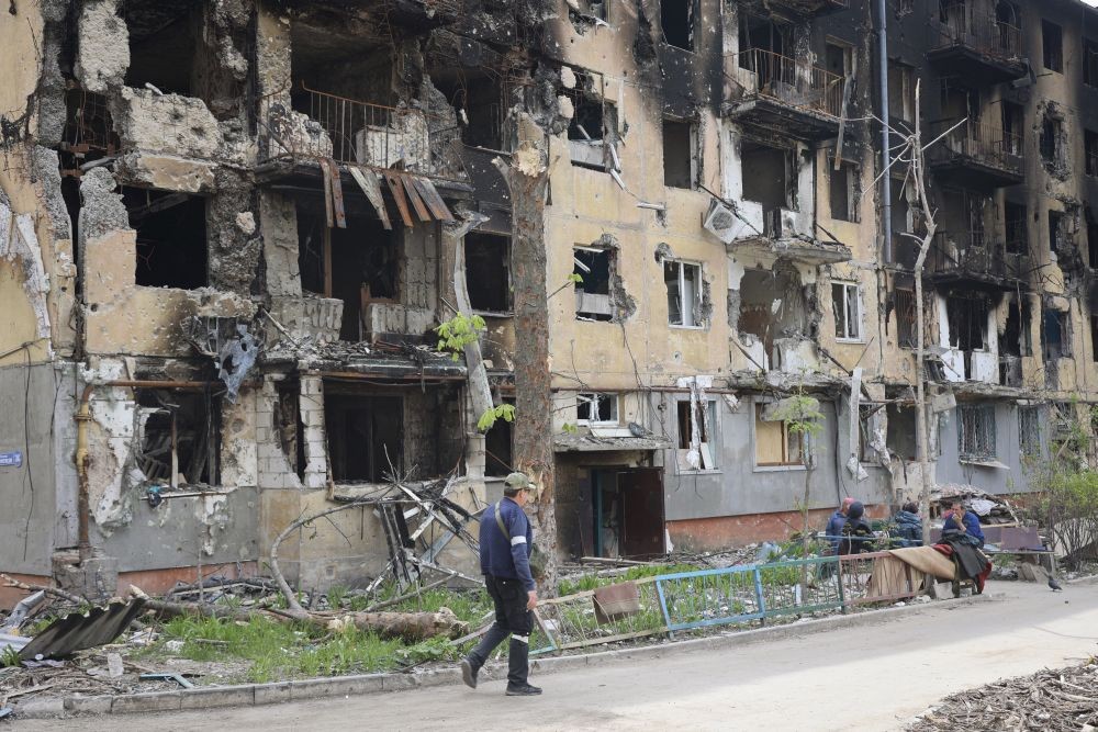 Mariupol : A man walks past a destroyed apartment building in Mariupol, in territory under the government of the Donetsk People's Republic, eastern Ukraine, Wednesday, May 4, 2022. AP/PTI