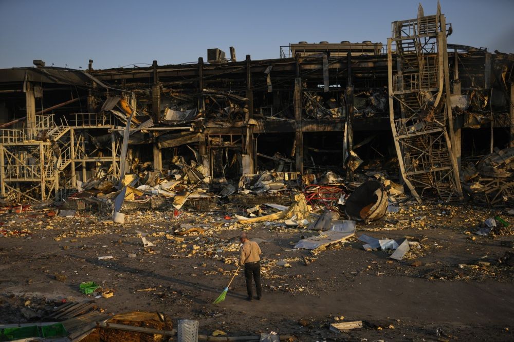 Odessa: A man sweeps rubble next to a shopping and entertainment mall destroyed after a Russian missiles strike on May 9, in Odessa, Ukraine, Friday, May 13, 2022. AP/PTI