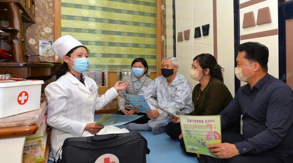 In this photo provided by the North Korean government, a doctor visits a family during an activity to raise public awareness of the COVID-19 prevention measures, in Pyongyang, North Korea Tuesday, May 17, 2022. (Photo source: AP)
