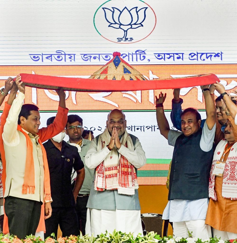Guwahati: Union Home Minister Amit Shah with Assam Chief Minister Himanta Biswa Sarma and Union Minister Sarbananda Sonowal during a public rally, at Khanapara Veterinary Ground in Guwahati, Tuesday, May 10, 2022. (PTI Photo)