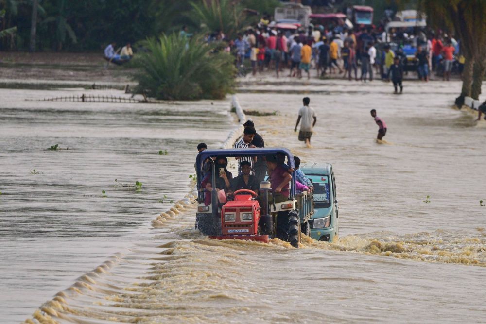 Nagaon: A tractor being used to transport flood-affected villagers, at Jamunamukh village in Nagaon district, Monday, May 16, 2022. (PTI Photo)