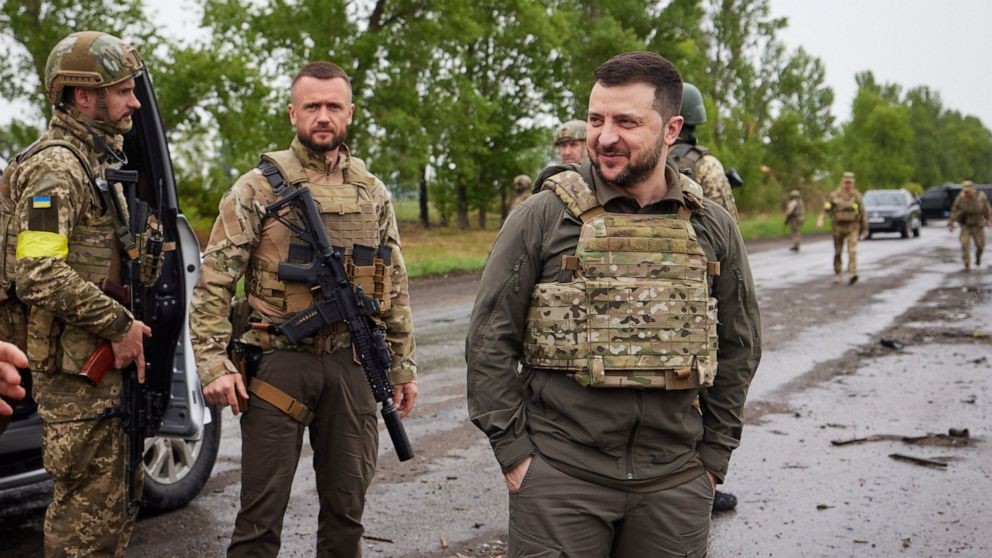 In this photo provided by the Ukrainian Presidential Press Office on Sunday, May 29, 2022, Ukrainian President Volodymyr Zelenskyy reacts as he visits the war-hit Kharkiv region. Volodymyr Zelenskyy described the situation in the east as "indescribably difficult." The "Russian army is trying to squeeze at least some result" by concentrating its attacks there, he said in a Saturday night video address. (Ukrainian Presidential Press Office via AP)