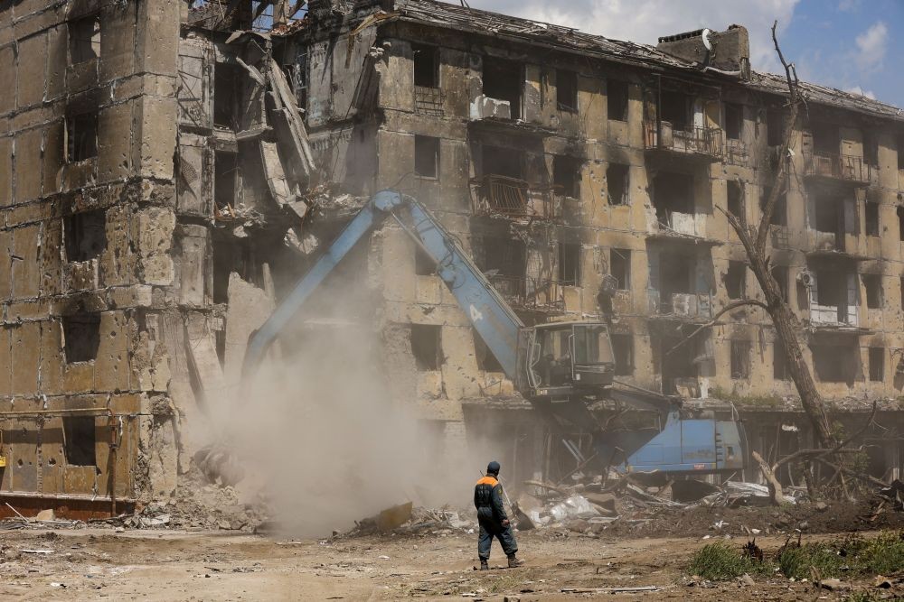 Russian Emergency Situations Ministry workers disassemble a destroyed building in Mariupol, in territory under the government of the Donetsk People's Republic, eastern Ukraine, Friday, May 27, 2022. AP/PTI(