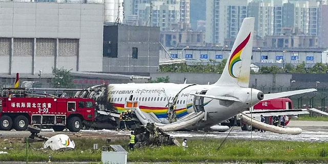 Passenger jet that veered off a runway during take-off and caught fire is seen in the aftermath in Chongqing Jiangbei International Airport in southwestern China's Chongqing (Photo | AP)