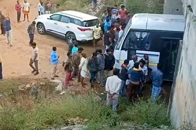 Police at the site of the encounter where four accused in the rape and murder of a veterinarian were shot dead. Photograph: PTI Photo
