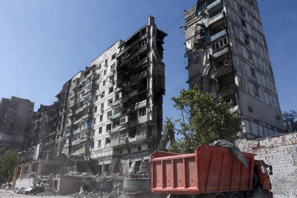 Mariupol: Donetsk People Republic Emergency Situations Ministry employees clear rubble at the side of damaged during a heavy fighting buildings in Mariupol, in territory under the government of the Donetsk People's Republic, eastern Ukraine, Thursday, May 12, 2022.AP/PTI