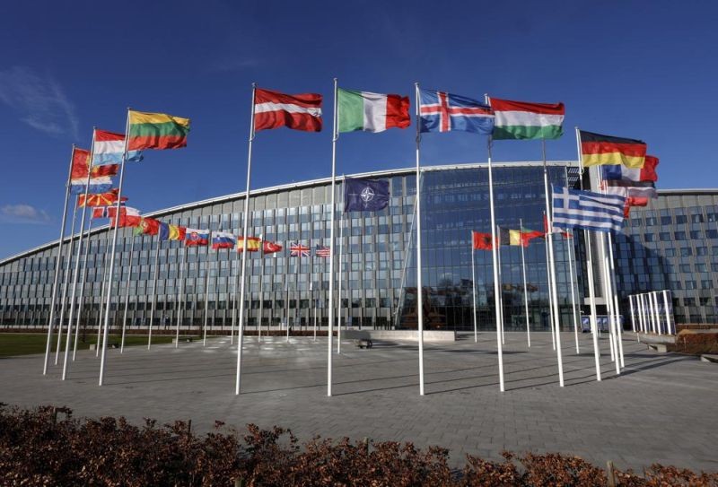 Flags flutter in the wind outside NATO headquarters in Brussels on February 7, 2022. With Finland and Sweden taking steps to join NATO, the list of 'neutral' countries in Europe appears poised to shrink. Security concerns over Russia's ongoing invasion of Ukraine changed the calculus for Finland and Sweden which have long espoused neutrality and caused other traditionally 'neutral' countries to re-think what that term really means for them. (AP File Photo)
