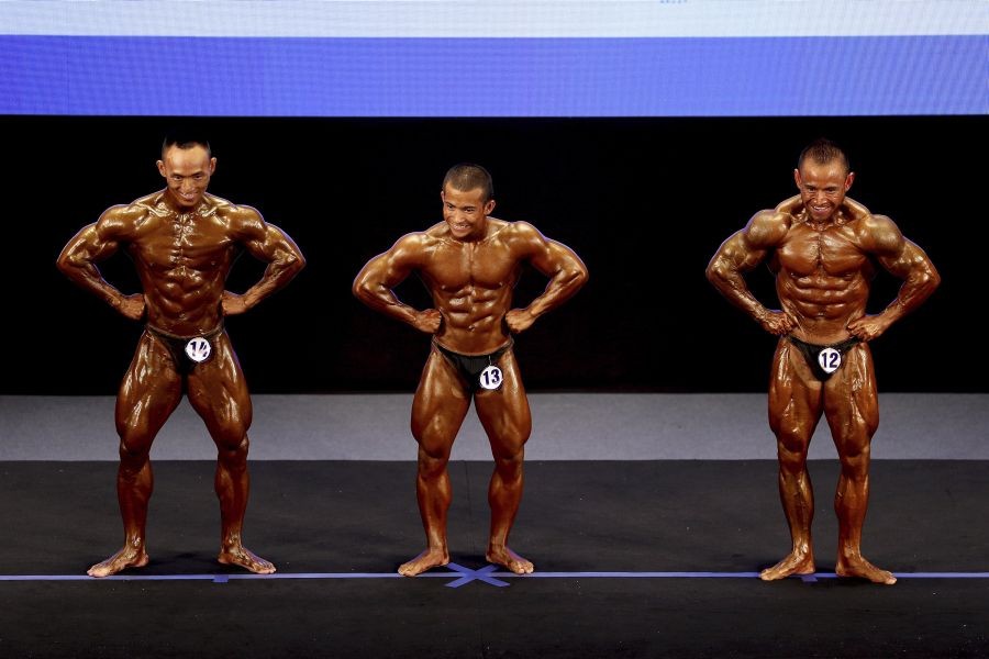 Hanoi: From left; Pham Van Phuoc of Vietnam, Kasem Rattanaporn and Jiraphan Pongkam of Thailand compete in Men's Bodybuilding 60kg during the 31st Southeast Asian Games (SEA Games 31) in Hanoi, Vietnam Friday, May 13, 2022. The SEA Games 31 takes place from May 12 to May 23 in Hanoi, and 11 nearby provinces.AP/PTI