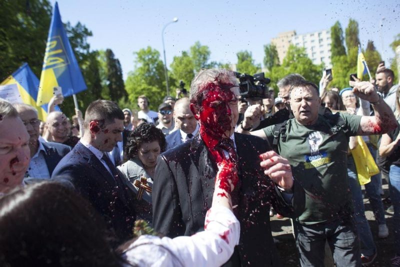 Russian Ambassador to Poland, Ambassador Sergey Andreev is covered with red paint in Warsaw, Poland on May 9. Protesters have thrown red paint on the Russian ambassador as he arrived at a cemetery in Warsaw to pay respects to Red Army soldiers who died during World War II. Ambassador Sergey Andreev arrived at the Soviet soldiers cemetery on Monday to lay flowers where a group of activists opposed to Russia’s war in Ukraine were waiting for him. (AP Photo)