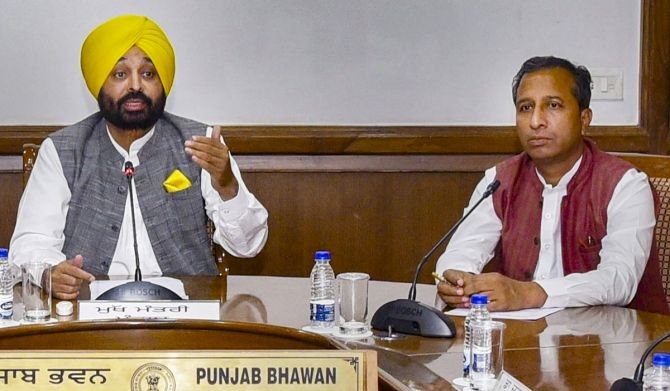 A file photo of Punjab Chief Minister Bhagwant Mann with Vijay Singla. Photograph: PTI Photo