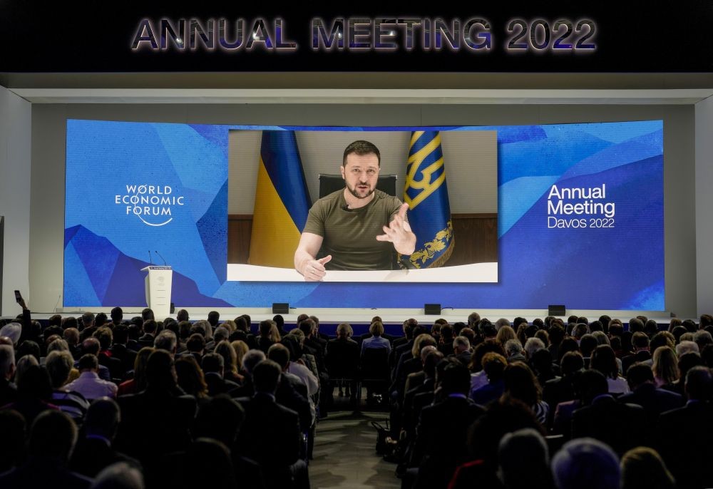 Ukrainian President Volodymyr Zelenskyy displayed on a screen as he addresses the audience from Kyiv on a screen during the World Economic Forum in Davos, Switzerland, Monday, May 23, 2022. The annual meeting of the World Economic Forum is taking place in Davos from May 22 until May 26, 2022. AP/PTI